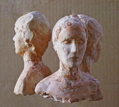 Sculpture of the bust of three people in small size made of plaster