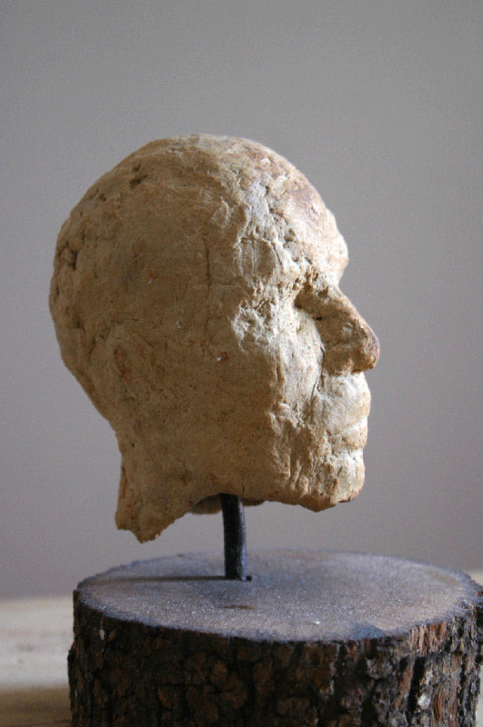 Sculpture of the head of a man in small size made of terracotta
